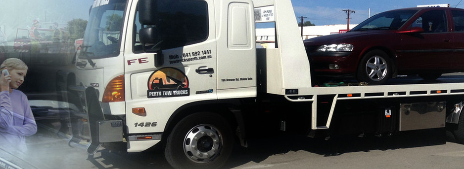 Perth Tow Trucks Pic 1 - Perth Tow Trucks our towing guys picking up another broken down car Fast reliable service Call us now