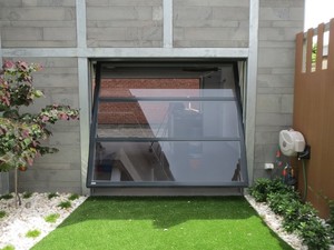 East Coast Garage Door Services Pic 2 - Smartech tilt glass door for garages or pavilion rooms