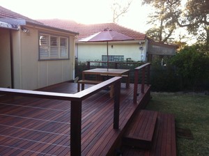 Emerald Building & Carpentry Services Pic 3 - Merbau decking posts handrail finished with stainless steel wires