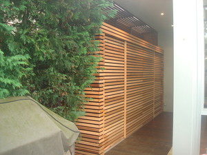 Emerald Building & Carpentry Services Pic 5 - Outside storage unit finished using cedar timber screening on a black backing board