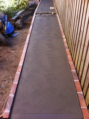 Imperial Concrete Group Pic 4 - Plain concrete ramp with brick edge