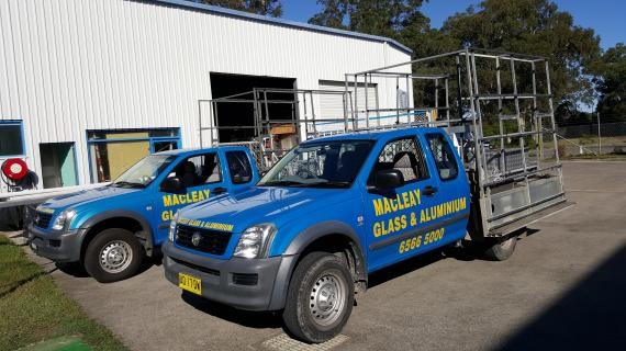 Macleay Glass & Aluminium Pic 1 - Multiple work vehicles and friendly workers