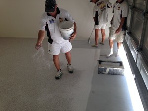 LNL Painting Pic 2 - Epoxy seamless flooring being completed on garage floor at Eli Waters by LNL Painting