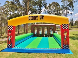 Buck a Bull Western Party Hire Pic 5 - Giddy Up Pony Hop fun game for all Jump on your inflatable pony and race to the other end