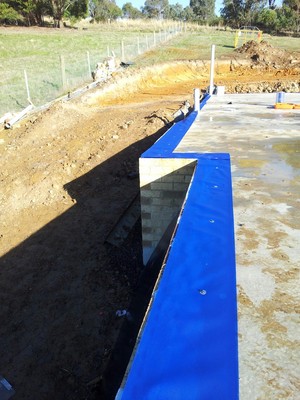 Best Termites Control Pic 2 - Homeguard Blue sheets installed to the edge of the slab