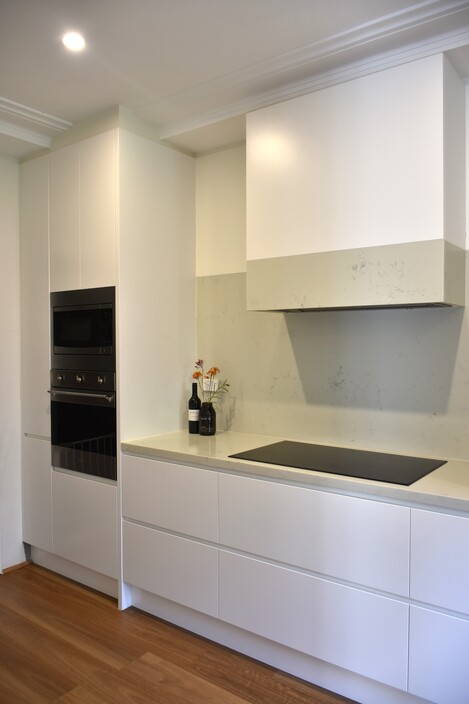 Decura Design Pic 1 - We created this timeless kitchen for our client in Ramsgate Beach We used engineered Carrara stone on the benchtop and splashback for a seamless look and for easy cleaning