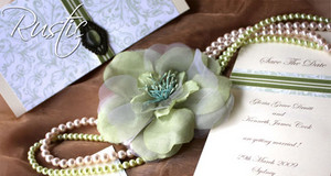 Tres Beau Luxury Boutique Pic 2 - rustic collection beautiful rustic green paisley designer paper tantalised with beige bazzil board fastened with stylish grosgrain french ribbon and embellished with antique jade ornament perfect for your traditional tuscany wedding scene