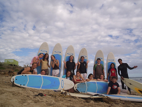 Midwest Surf School and Tours Pic 2 - midwest surf school and tours group about to head out for a surf at geraldtons back beach