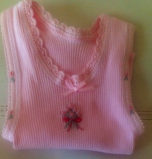 Disgifts Pic 3 - Baby singlets are bonds brand a d embroidered with silk thread in bullion stitch of roses or bunnies and have a crocheted edge around neckline Comes in all sizes and colours