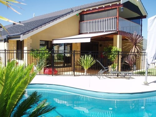 Nu-Style Awnings Pic 1 - poolside living with protection from the sun