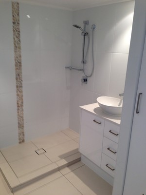 Gold Coast Classic Renovations Pic 2 - Add a 2pac vanity and oval basin with a tumbled lime stone freaze and you can appreciate how we utilized the small space