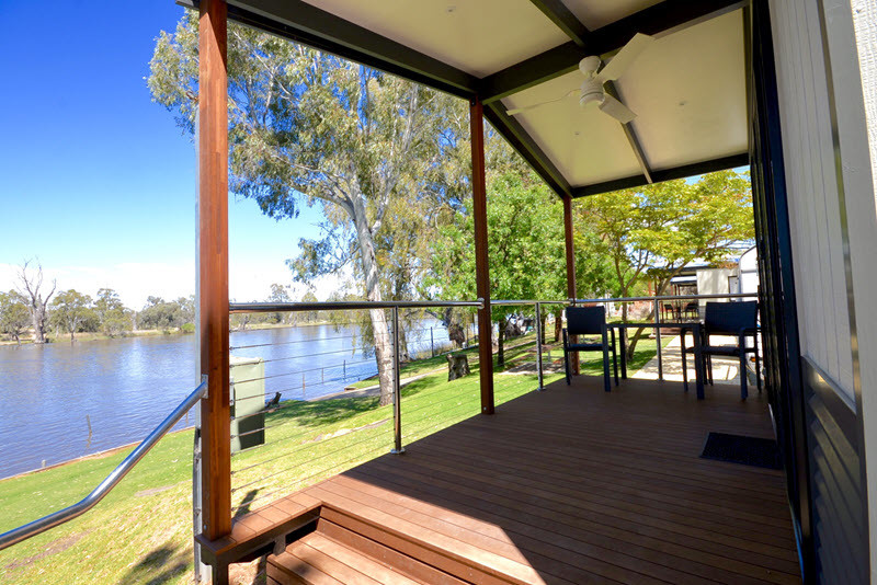 Rivergardens Holiday Park Pic 1 - Executive Riverview Cabin Furnished Balcony