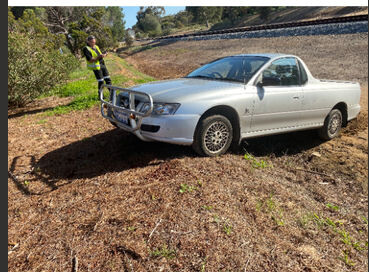 Brookton 24/7 Towing Pic 1 - Tow Truck driver on phone as pictured 2 hours later he gets the car out of the ditch which was all of 5 minutes