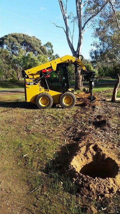 Hosey Earthworks Pic 1 - Caterpillar Bobcat Drilling holes