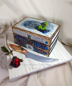 Sweet Madness Cake Designs Pic 1 - A Game of Thrones inspired book cake Redesigned covers Images obtained under a creative commons licence bookcakes gameofthronescakes ediblecaketoppers sugarflowers artist