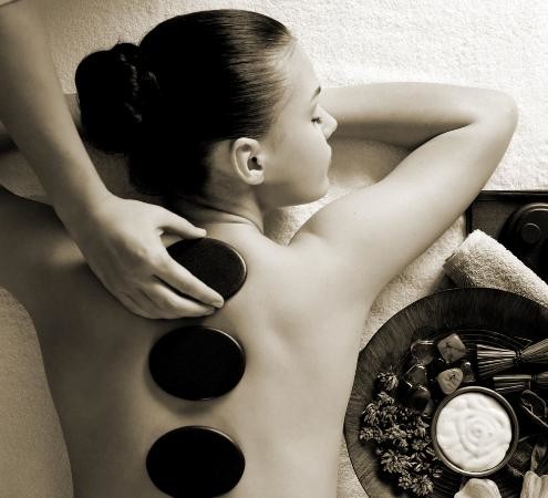 Invoque Skin Clinic Pic 1 - Hot Stone Massage will melt away tension ease muscle stiffness increases circulation metabolism it is truly the ultimate relaxation massage