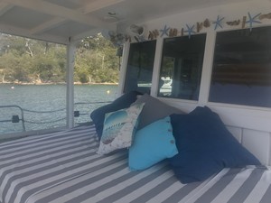 Classic Boat Cruises Pic 3 - Relax on the day bed with friends Theres plenty of room