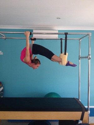 Pilates With Nikki Pic 2 - Hanging Back on the Cadilac