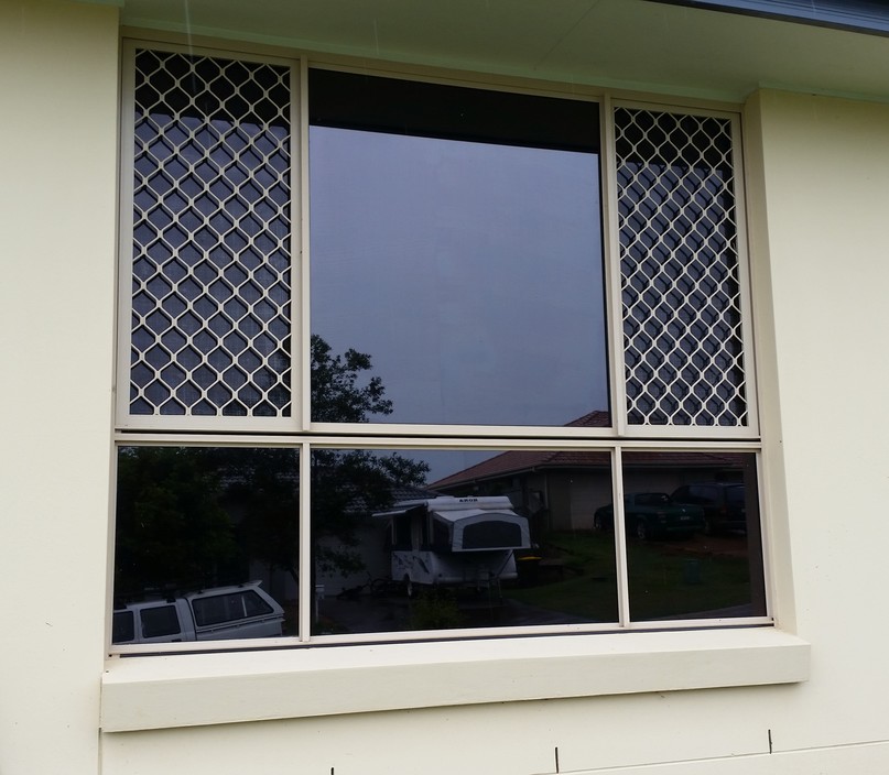 Rusty's Window Tinting Pic 1 - Dark tinting makes your house look and feel cool