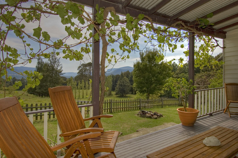 Minimbah Farm Cottages Pic 1 - old homestead balcony