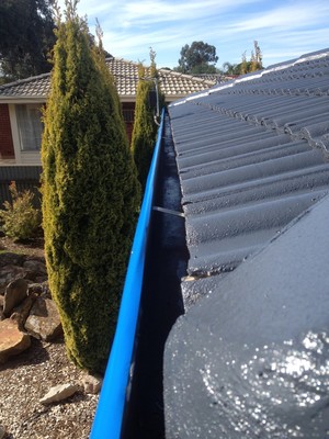 Aquaguard Pic 4 - Gutters are taped along the top to protect during the painting process