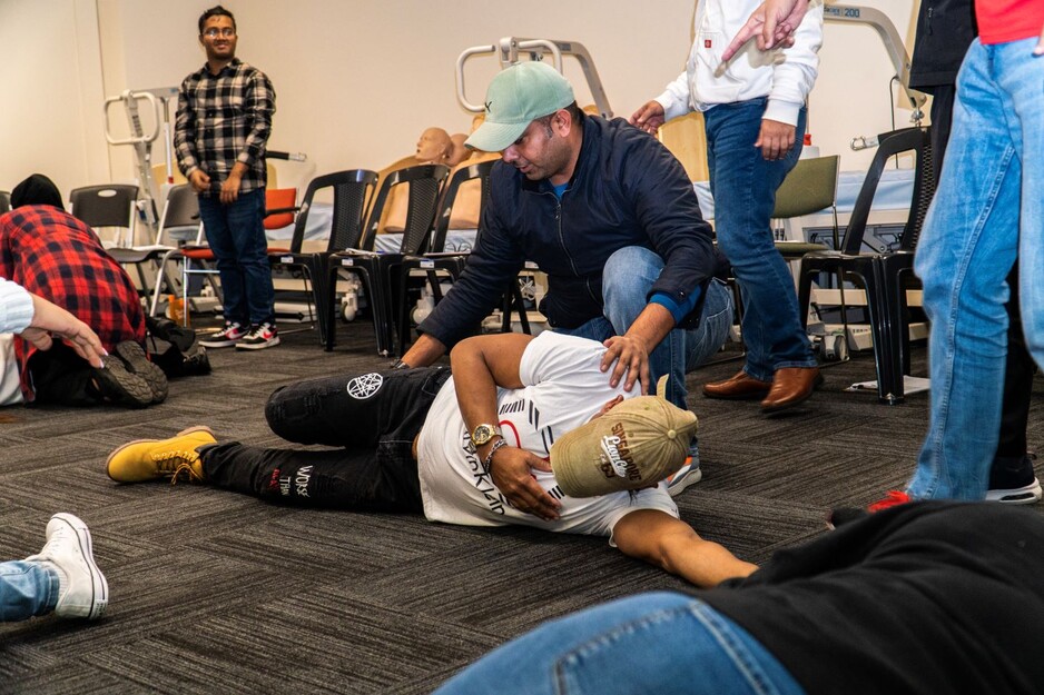 FirstAidPro - Mount Gambier Pic 1 - First aid training putting man into recovery position FirstAidPro Mount Gambier SA