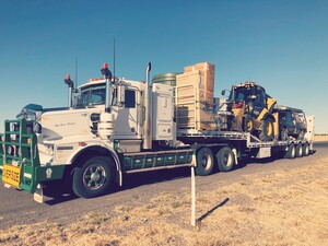 Crawford Plumbing Pic 3 - Kenworth truck and float to transport our machinery to site