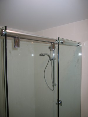 Glass Distinction Pic 4 - sliding 10mm frameless Shower Screen mechanism are fast gaining popularity in Sydney as bathroom spacesaver