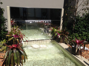 Glass Distinction Pic 3 - This Mirror lends beauty to the outside water feature