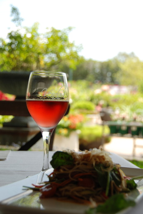 Verdant Restaurant Pic 2 - Glass of wine overlooking the nursery at GardenWay