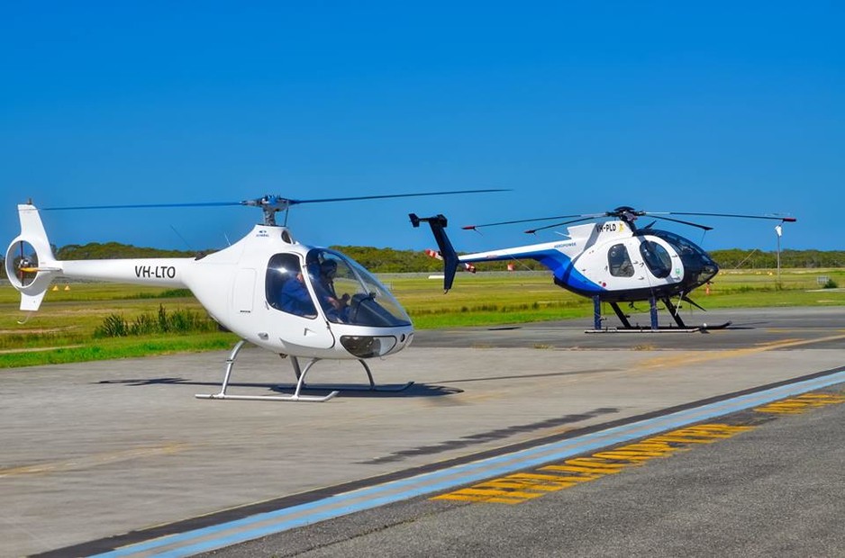 Aeropower Flight School Pic 1 - One of our Cabri G2s VHLTO that we deliver training in parked along side one of our MD500s VHPLD