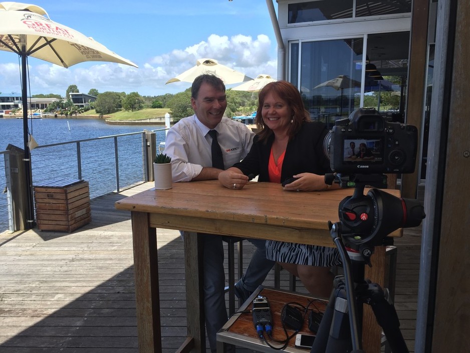 One Agency Caloundra Pic 1 - John and Janzey Pratt Owners and Directors filming on location at Pelican Waters