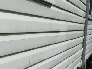 F1 Cleaning Services Pic 2 - Before shot of weatherboard being pressure cleaned