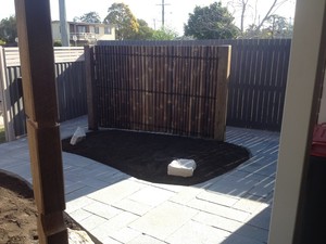 Johnsons Landscapes Pic 2 - Lime Stone Paving custom cut and laid to French pattern Bamboo screening to hide wheelie bins