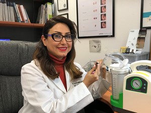 ACE Audiology and Hearing Pic 5 - Dr Yazdaneh Galt Audiologist working with Ear Wax Suctioning Equipment