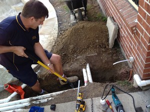 Barry's Electrical Contracting Pic 4 - Chris trenching for a pool power supply in Upper Kedron