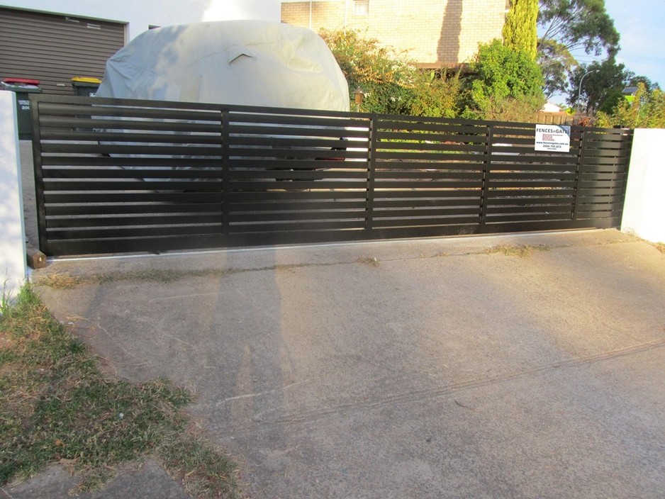 FENCES n GATES Pic 1 - Aluminium slatted swing gate