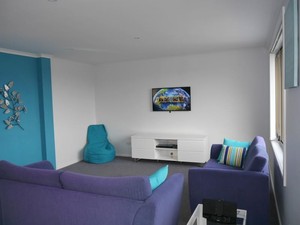 The Beach Escape @ Primrose Sands Pic 5 - The living room features a 40 LCD TV and bluray player