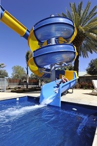 BIG4 MacDonnell Range Holiday Park Pic 3 - Relax by the pool whilst the Kids enjoy the water slide and pools