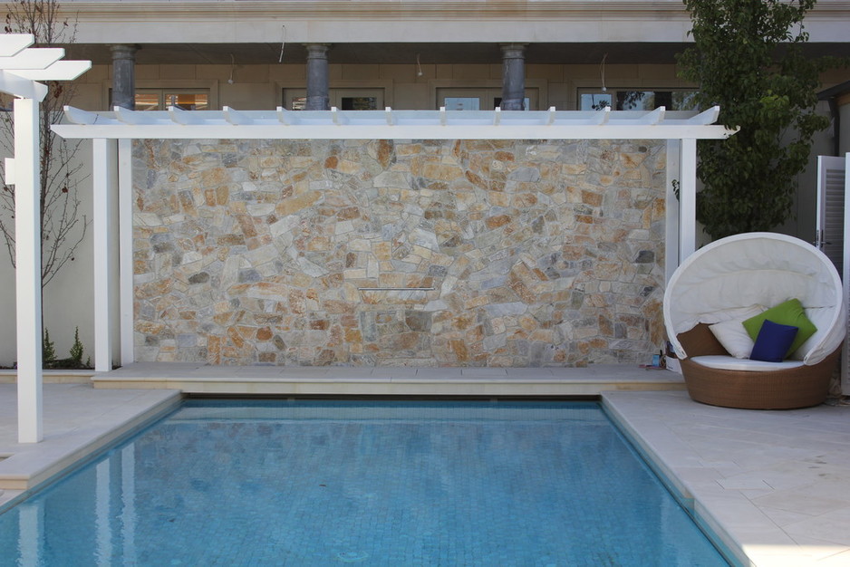 Ingardens Landscaping Pic 1 - Feature stone wall to compliment the formal pool and surrounds