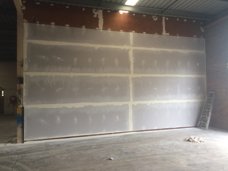 John Shannon Carpentry & Maintenance Pic 1 - Re sheeting setting of garage wall