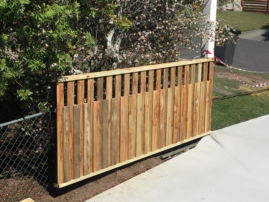 Carpentry and Maintenance Pic 1 - Trapezoid Custom built electronic remote gate Steel frame and timber cladding