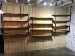 Carpentry and Maintenance Pic 2 - Custom Shelving Infill shopfront windows with shadowclad and install custom pipe shelving