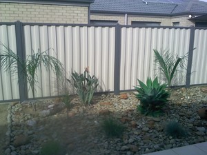 RELIABLE FENCING Pic 2 - colorbond fence with treated pine plinth at bottom