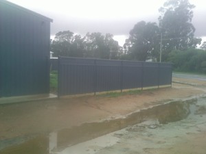 RELIABLE FENCING Pic 3 - colorbond fence with treated pine plinth at bottom and slat lattice exstensions at top