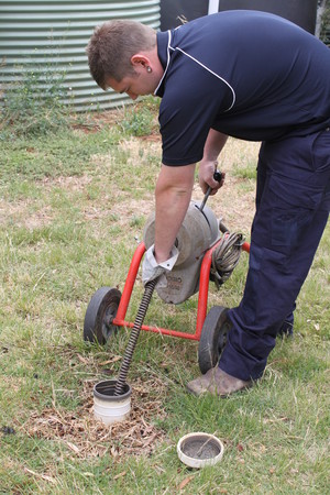 Tait Plumbing Pic 3 - Plumber using Sewer machine on property in Brookfield Acres