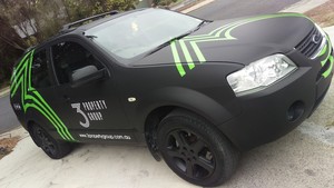 Pixel Monster Pic 3 - Full Matte Black Ford Territory Wrap with Green White Vinyl Graphics for 3 Property Group