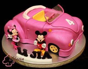 Gloria Cake Pic 2 - Minnie Birthday Cake Carshaped birthday cake Invite Minnie and Mickey to your child birthday party Shell arrive in style in her wonderful pink convertible