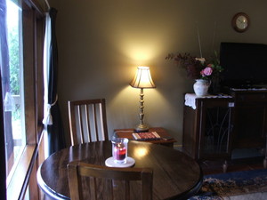 Lisnagarvey Cottage B&b Pic 4 - Dining area overlooking the deck and views beyond