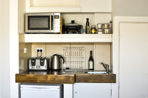 Destination Kyneton Pic 5 - Harrys kitchenette with electric jug toaster microwave frypan fridge and fresh breakfast provisions